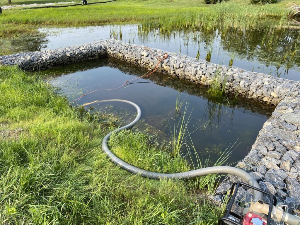 Sediment trap in a stormwater pond designed to capture sediment and prevent erosion.