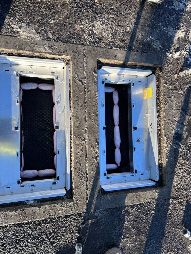 Top view of dual stormwater catch basins, highlighting the structure and components of what is a catch basin for effective stormwater drainage.