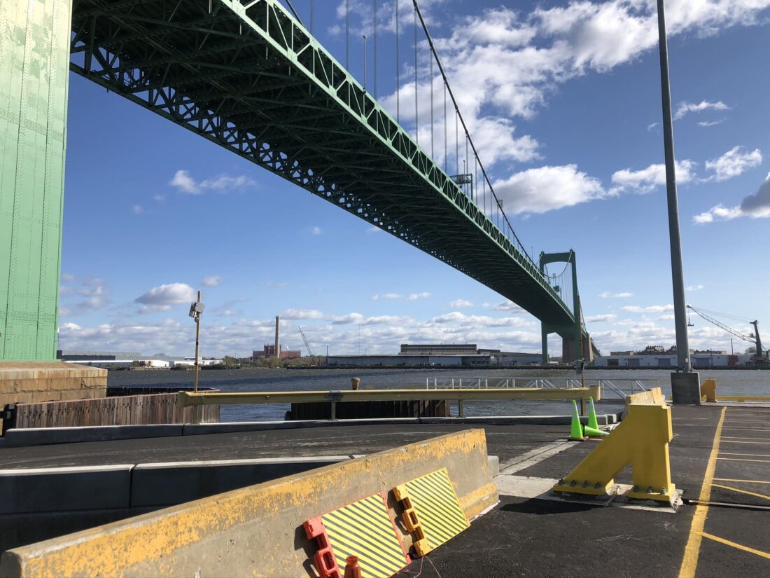 View of a bridge over the Delaware River in Philadelphia, representing urban infrastructure tied to stormwater management and green infrastructure initiatives outlined in Philadelphia stormwater regulations.